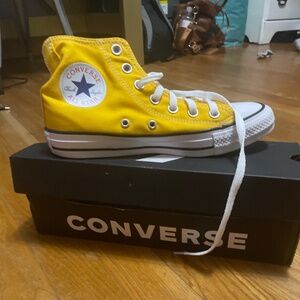 Yellow high top Chuck Taylor’s